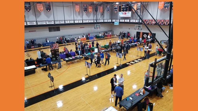 gym full of tables and students